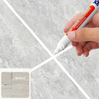 Arenzza Tile Marker Grout Pen for tools and garden, showing a close-up of the pen with white ink on a tile surface.