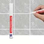 Arenzza Tile Marker Grout Pen in use, showing white grout marking on tiles for tools and garden maintenance.