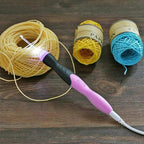 A set of 11 Arenzza crochet hooks with integrated LED lights, displayed in a plastic storage case for knitting and crochet projects.