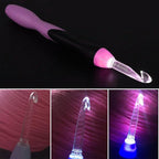 A set of 11 Arenzza crochet hooks with built-in LED lights, displayed together with various sizes for knitting and crochet projects.