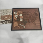 A 3D wooden travel map puzzle by Arenzza, featuring detailed wooden pieces shaped like continents and countries for kids and gifts.