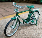 Arenzza DIY bicycle model toy for kids, featuring a detailed miniature bicycle with colorful parts and assembly components.