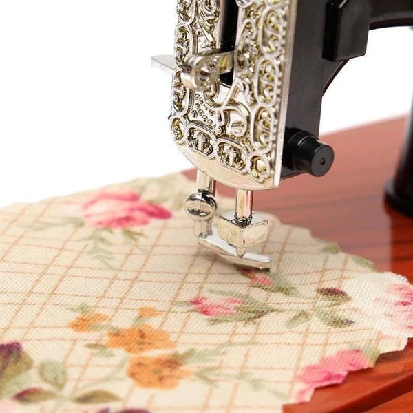 Arenzza wood mini sewing machine music box toy for kids, featuring a detailed miniature sewing machine design with musical elements.