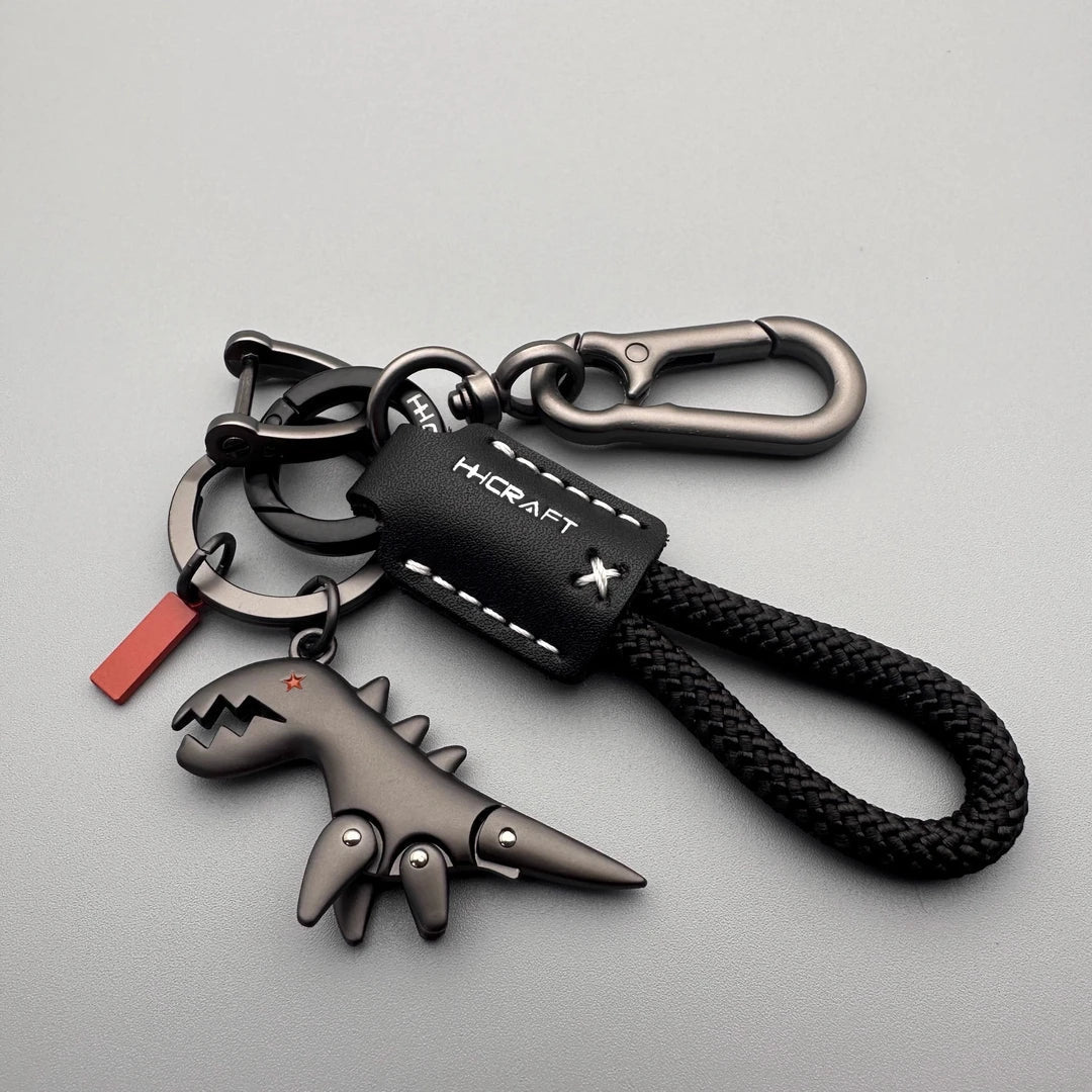 Arenzza aluminum alloy dinosaur charm paired with a woven bracelet, suitable as a kids' toy or gift accessory.