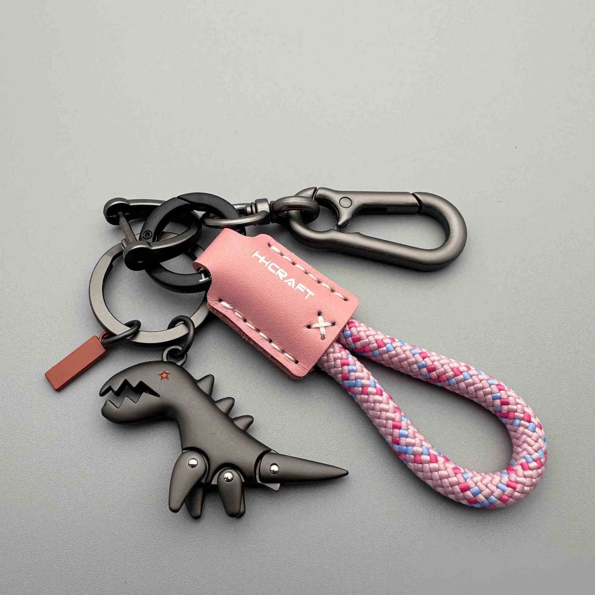 Arenzza aluminum alloy dinosaur charm attached to a hand-woven bracelet, ideal for kids' toys and gift accessories.