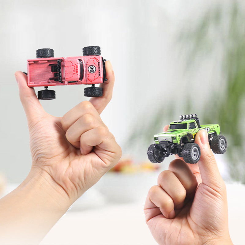 Arenzza OEIN Mini RC Monster Truck toy with large wheels and vibrant red body, perfect for kids' play and outdoor fun.