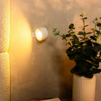 Arenzza wireless magnetic wall lamp with 360° rotating light, mounted on a wall, showing adjustable positioning and modern design.