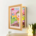 Aarenza kids art display frame showing colorful children's drawings mounted on a wall for easy viewing and decoration.