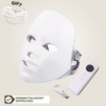 Aurenza Shop Face Mask Light Therapy Pro Wireless, black facial mask with LED lights for skin treatment, shown on a model's face.