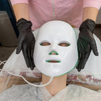 Aurenza Shop Face Mask Light Therapy Pro Wireless, front view showing the sleek black design with adjustable straps.