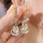 WIMAID™ Lymph Flow Magnetogen Earrings featuring sleek silver design with magnetic elements for lymphatic health support.