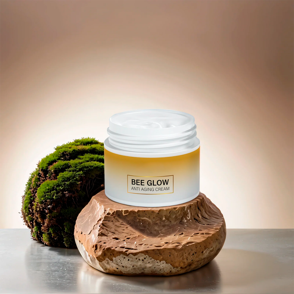 Aurenza Shop Bee Glow Anti-Aging Cream jar with gold lid and clear label, highlighting natural skincare benefits.