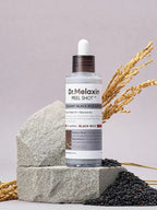 Aurenza Shop Dr.Melaxin Peel Shot Glow Rice Ampoule Duo in black and white bottles, highlighting skincare packaging and design.