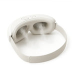 Aurenza Shop Kahuna Steam Therapy Goggles resting on a white surface, showing sleek design and adjustable strap for facial steam therapy.