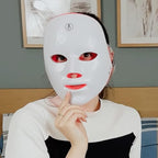 Aurenza Shop Kahuna Red Therapy Facial Mask massager with red handheld device for facial skin treatment and relaxation.