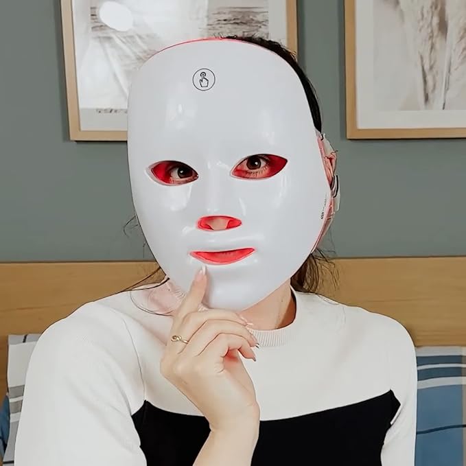Aurenza Shop Kahuna Red Therapy Facial Mask massager with red handheld device for facial skin treatment and relaxation.