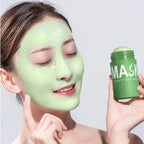 Serenzza green tea purifying clay face mask with oil control and blackhead removal, shown in a jar with fresh green tea leaves.